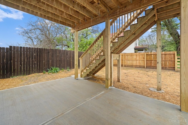 view of patio / terrace featuring stairway and a fenced backyard