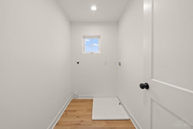 washroom with electric dryer hookup, light wood-style flooring, baseboards, washer hookup, and recessed lighting