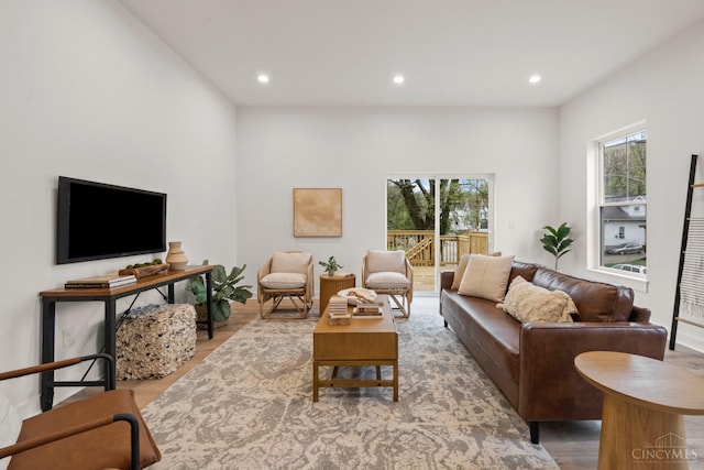 living room with wood finished floors and recessed lighting