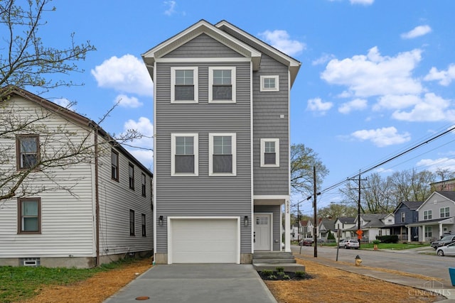 view of front of house featuring a residential view, driveway, and an attached garage