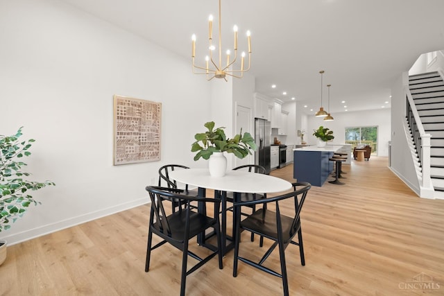dining area with light wood-style flooring, recessed lighting, baseboards, a chandelier, and stairway