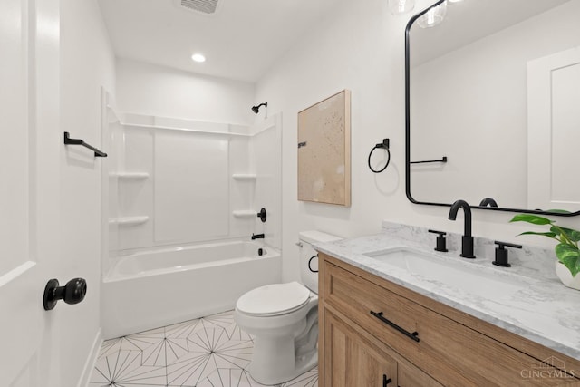 full bath featuring toilet, vanity, tile patterned floors, and washtub / shower combination