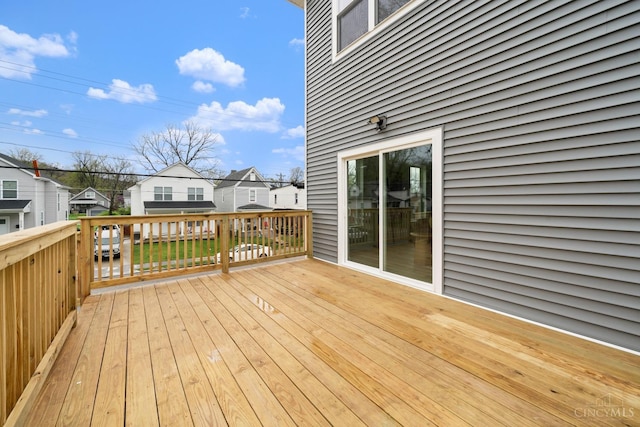 wooden terrace featuring a residential view