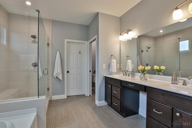 7690 Wharton Ct, West Chester, OH 45069 - full bath featuring a stall shower, double vanity, and a tub