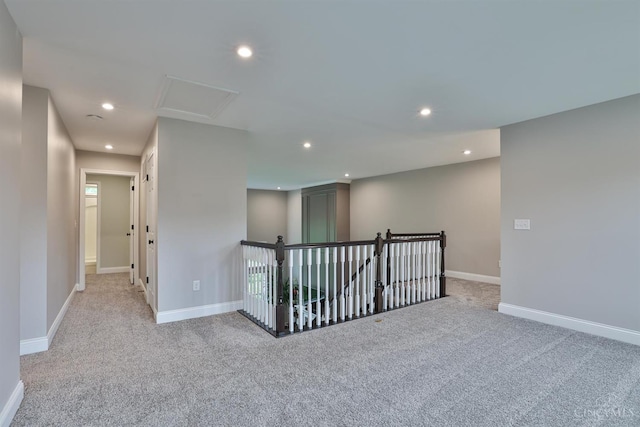 7690 Wharton Ct, West Chester, OH 45069 - empty room with carpet flooring, recessed lighting, and attic access