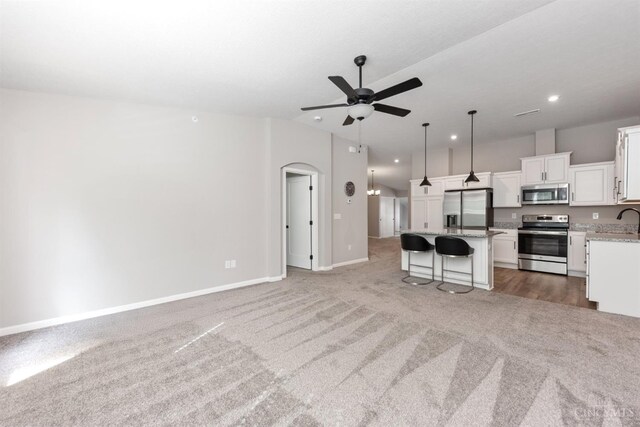 5880 Parkview Ln Unit 303, Miami Twp, OH 45150 - kitchen with stainless steel appliances, open floor plan, light carpet, and recessed lighting