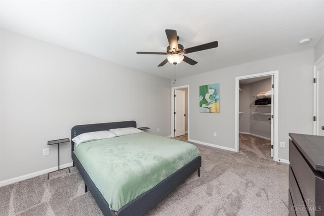 5880 Parkview Ln Unit 303, Miami Twp, OH 45150 - bedroom featuring carpet, a spacious closet, baseboards, ceiling fan, and a closet