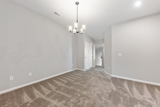 5880 Parkview Ln Unit 303, Miami Twp, OH 45150 - carpeted empty room with a chandelier, baseboards, and lofted ceiling