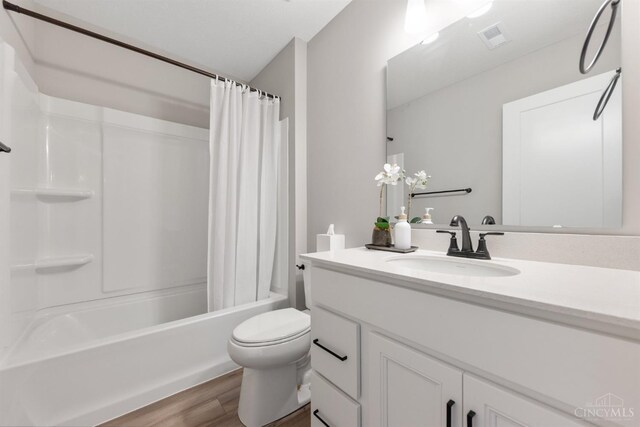 5880 Parkview Ln Unit 303, Miami Twp, OH 45150 - bathroom featuring wood finished floors, vanity, shower / bath combo, and toilet