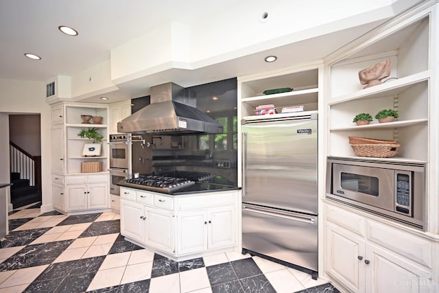 1 Beech Crest Ln, Cincinnati, OH 45206 - kitchen with open shelves, built in appliances, exhaust hood, white cabinetry, and recessed lighting