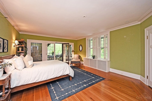 1 Beech Crest Ln, Cincinnati, OH 45206 - bedroom with crown molding, multiple windows, baseboards, wood finished floors, and access to outside