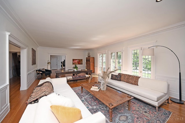 1 Beech Crest Ln, Cincinnati, OH 45206 - living area with crown molding, light wood-style floors, wainscoting, a decorative wall, and french doors
