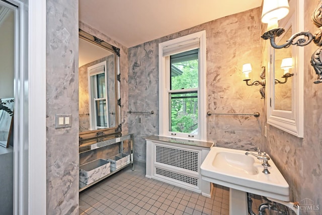 1 Beech Crest Ln, Cincinnati, OH 45206 - bathroom with tile patterned floors, radiator, and a sink