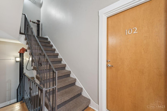 1406 Republic St Unit 102, Cincinnati, OH 45202 - staircase featuring wood finished floors and baseboards