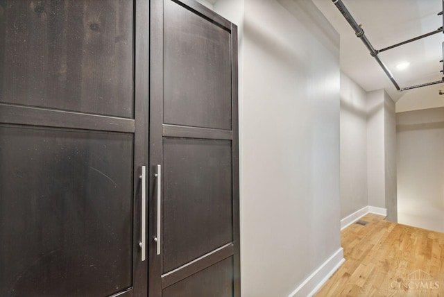 1406 Republic St Unit 102, Cincinnati, OH 45202 - hall with baseboards and light wood-style flooring