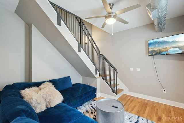 1406 Republic St Unit 102, Cincinnati, OH 45202 - living room featuring wood finished floors, baseboards, ceiling fan, and stairway