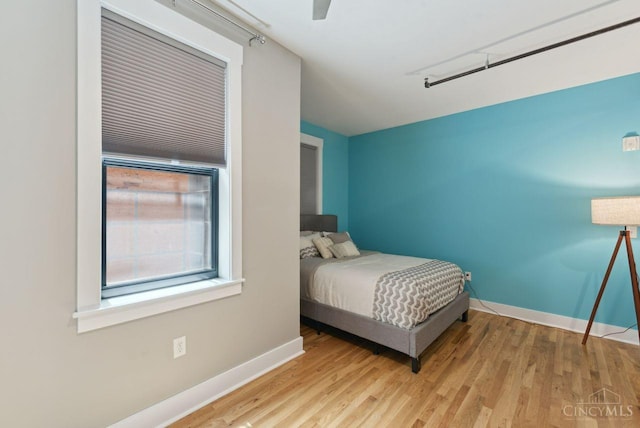 1406 Republic St Unit 102, Cincinnati, OH 45202 - bedroom featuring baseboards, wood finished floors, and ceiling fan