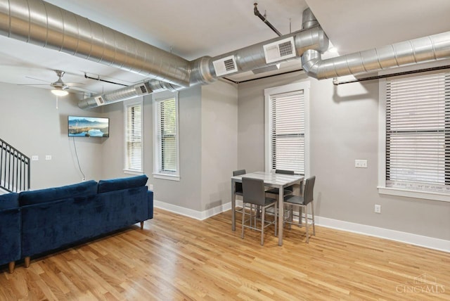 1406 Republic St Unit 102, Cincinnati, OH 45202 - dining area with light wood-style flooring, ceiling fan, and baseboards