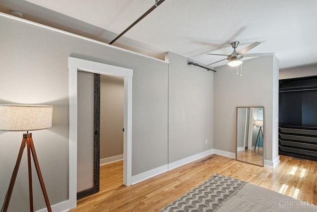 1406 Republic St Unit 102, Cincinnati, OH 45202 - unfurnished living room with a ceiling fan, wood finished floors, baseboards, and stairs