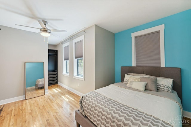 1406 Republic St Unit 102, Cincinnati, OH 45202 - bedroom with wood finished floors, baseboards, and ceiling fan
