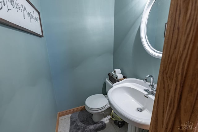 8588 Twincreek Dr, Franklin Twp, OH 45005 - bathroom with a sink, toilet, and tile patterned flooring