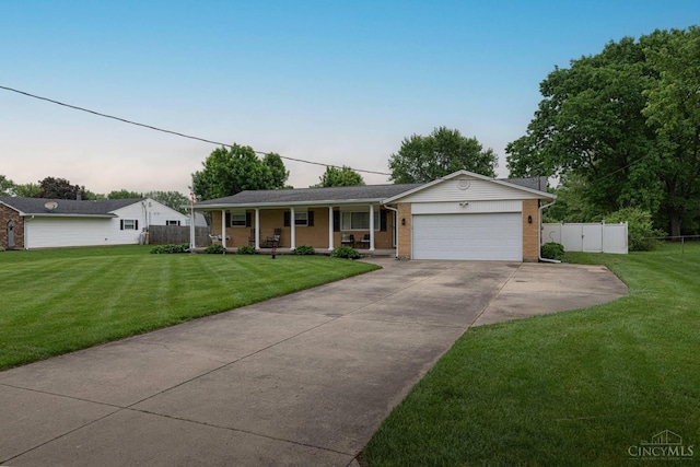 8588 Twincreek Dr, Franklin Twp, OH 45005 - ranch-style home featuring covered porch, a garage, concrete driveway, and brick siding