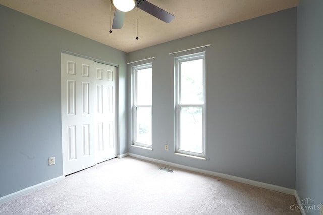1260 Pine Forest Dr, Pierce Twp, OH 45102 - unfurnished bedroom featuring baseboards, carpet, and multiple windows