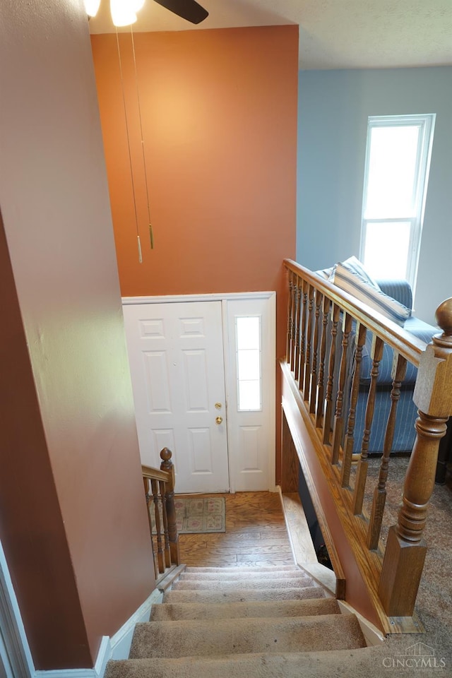 1260 Pine Forest Dr, Pierce Twp, OH 45102 - staircase featuring a ceiling fan and wood finished floors