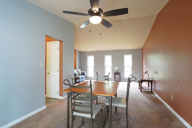 1260 Pine Forest Dr, Pierce Twp, OH 45102 - carpeted dining space with ceiling fan, baseboards, and lofted ceiling