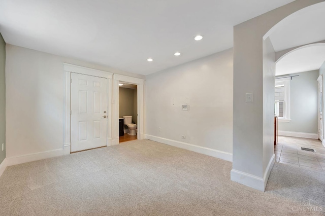 4604 Simpson Ave, Cincinnati, OH 45227 - carpeted spare room featuring arched walkways, baseboards, and recessed lighting