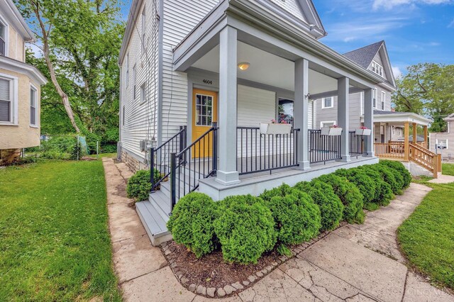 4604 Simpson Ave, Cincinnati, OH 45227 - entrance to property featuring covered porch and a lawn