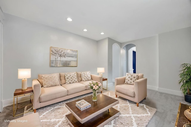 4604 Simpson Ave, Cincinnati, OH 45227 - living room with arched walkways, carpet, baseboards, and recessed lighting