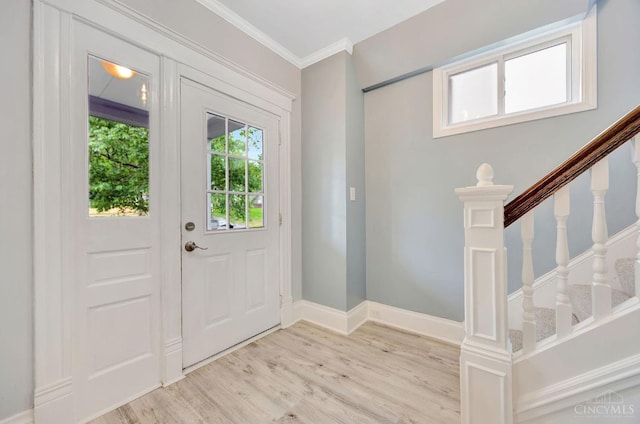 4604 Simpson Ave, Cincinnati, OH 45227 - foyer entrance featuring light wood-type flooring, stairs, crown molding, and baseboards