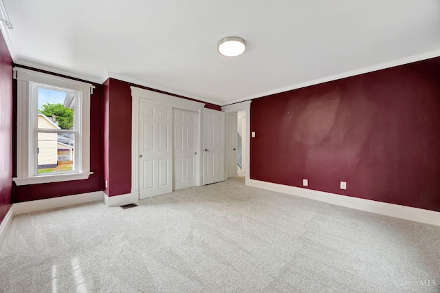 4604 Simpson Ave, Cincinnati, OH 45227 - unfurnished bedroom featuring carpet, crown molding, and baseboards