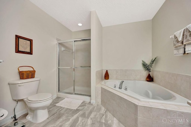 full bathroom featuring toilet, a bath, a shower stall, a textured ceiling, and baseboards