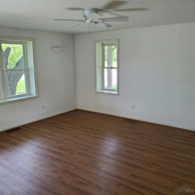10595 Cozaddale Murdock St, Hamilton Twp, OH 45122 - unfurnished room featuring a ceiling fan, dark wood-style flooring, and baseboards