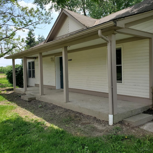 10595 Cozaddale Murdock St, Hamilton Twp, OH 45122 - view of property exterior featuring roof with shingles and covered porch