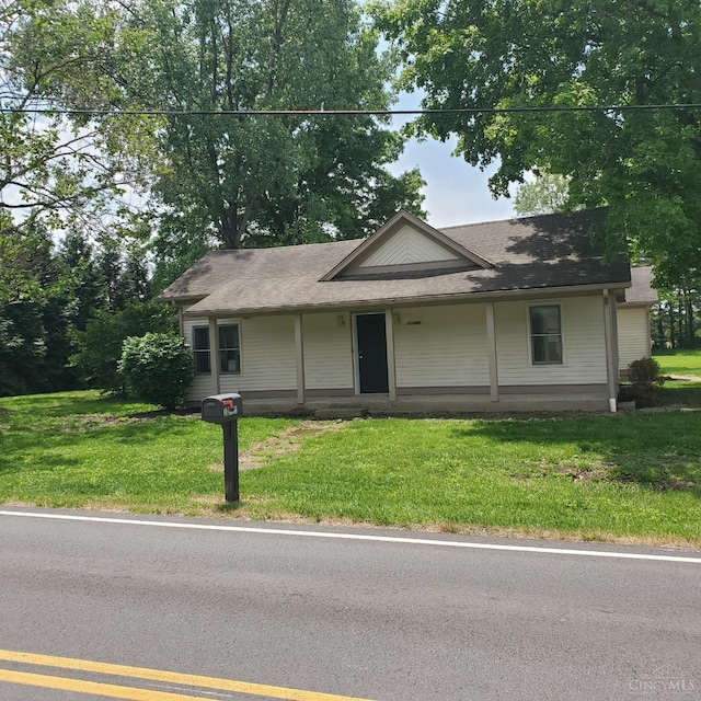 10595 Cozaddale Murdock St, Hamilton Twp, OH 45122 - view of front of home with a front yard and a shingled roof