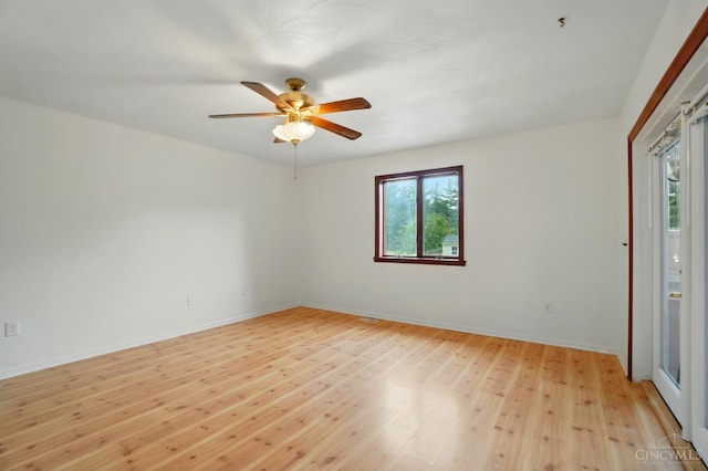 unfurnished room with plenty of natural light, light wood-type flooring, ceiling fan, and baseboards