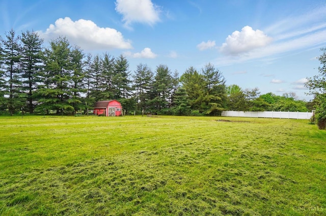 view of yard with an outbuilding and a barn