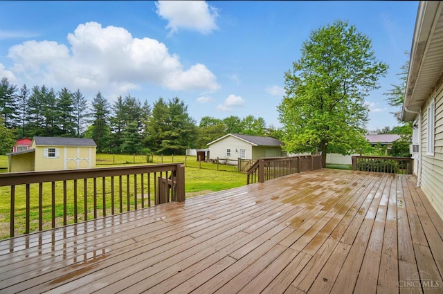 deck with an outdoor structure and a storage shed