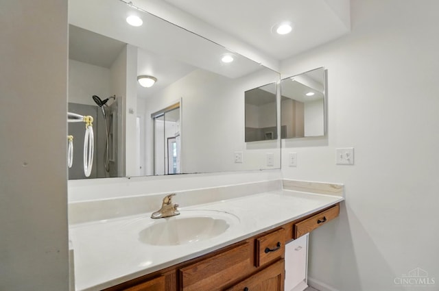 bathroom featuring vanity and recessed lighting