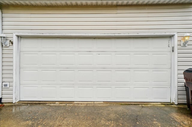 garage with asphalt driveway