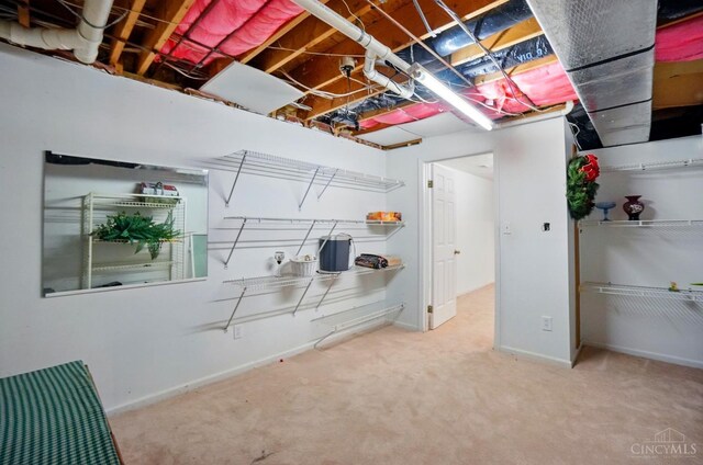 unfinished basement featuring carpet floors and baseboards