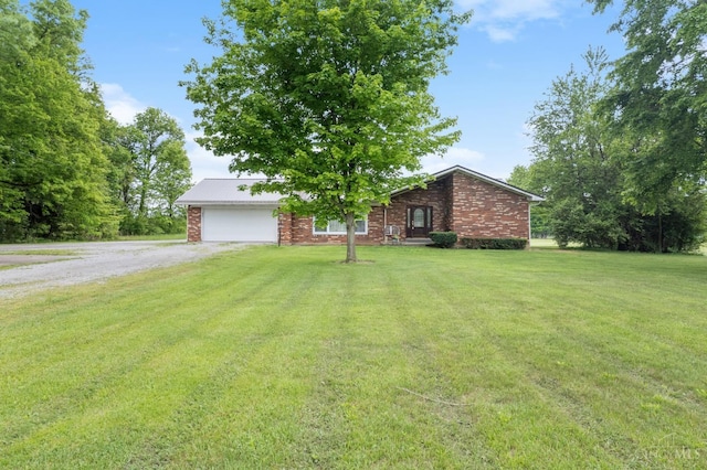 mid-century home featuring driveway, a garage, a front lawn, and brick siding