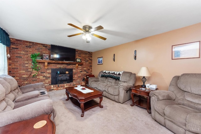 carpeted living area with a wood stove, ceiling fan, and brick wall