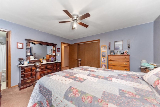 carpeted bedroom featuring a closet, a ceiling fan, and baseboards
