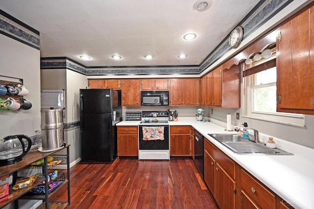 5638 Victoryview Ln, Delhi Twp, OH 45233 - kitchen featuring black appliances, a sink, brown cabinets, light countertops, and dark wood-type flooring