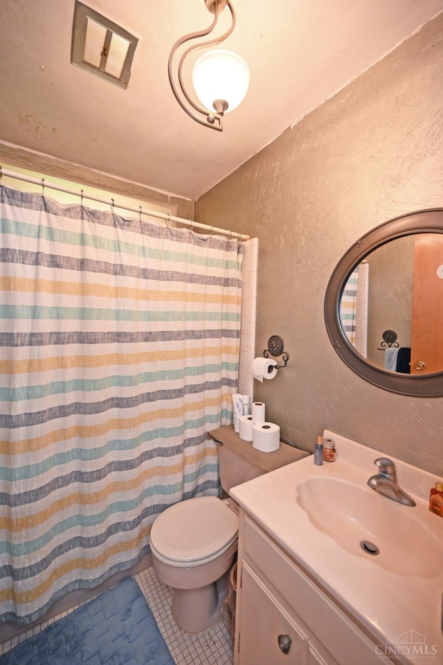5638 Victoryview Ln, Delhi Twp, OH 45233 - full bathroom with a textured wall, vanity, toilet, tile patterned flooring, and a shower with shower curtain