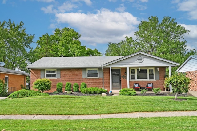5638 Victoryview Ln, Delhi Twp, OH 45233 - ranch-style house featuring brick siding, a front yard, and a porch